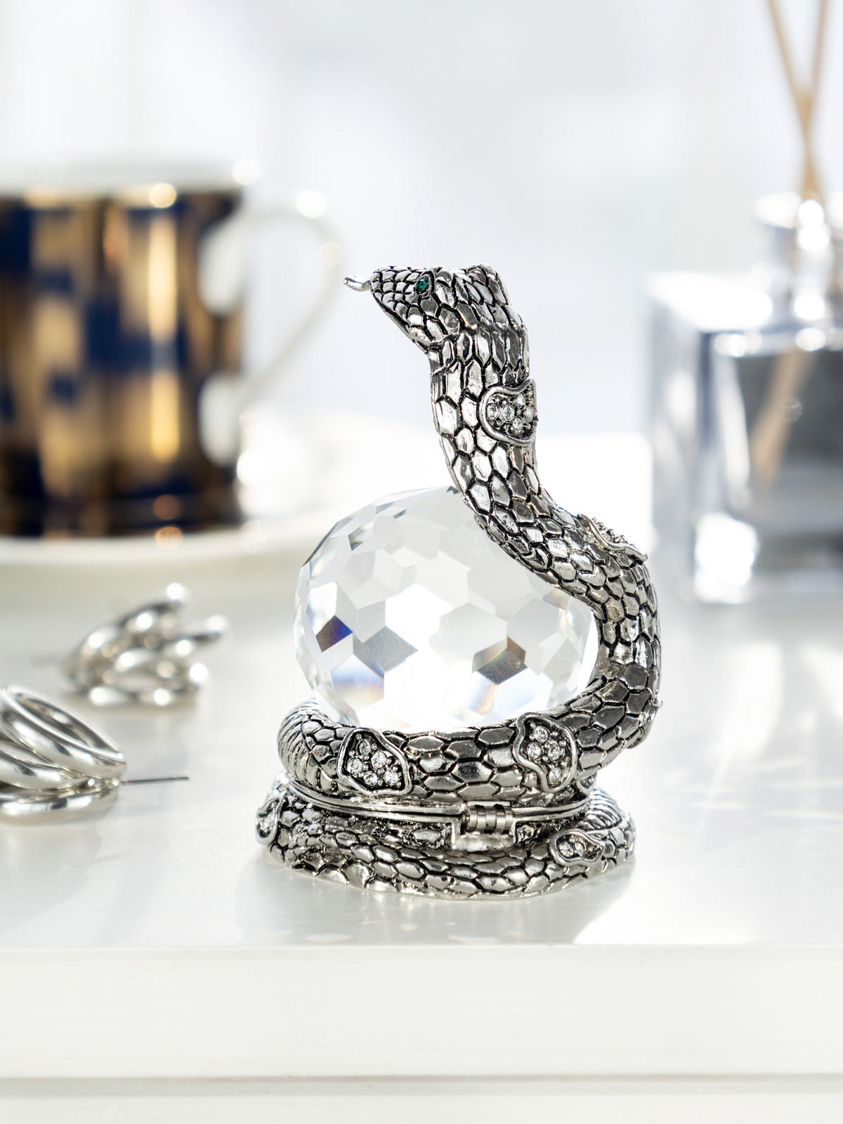 Keren Kopal Snake Holding Crystal