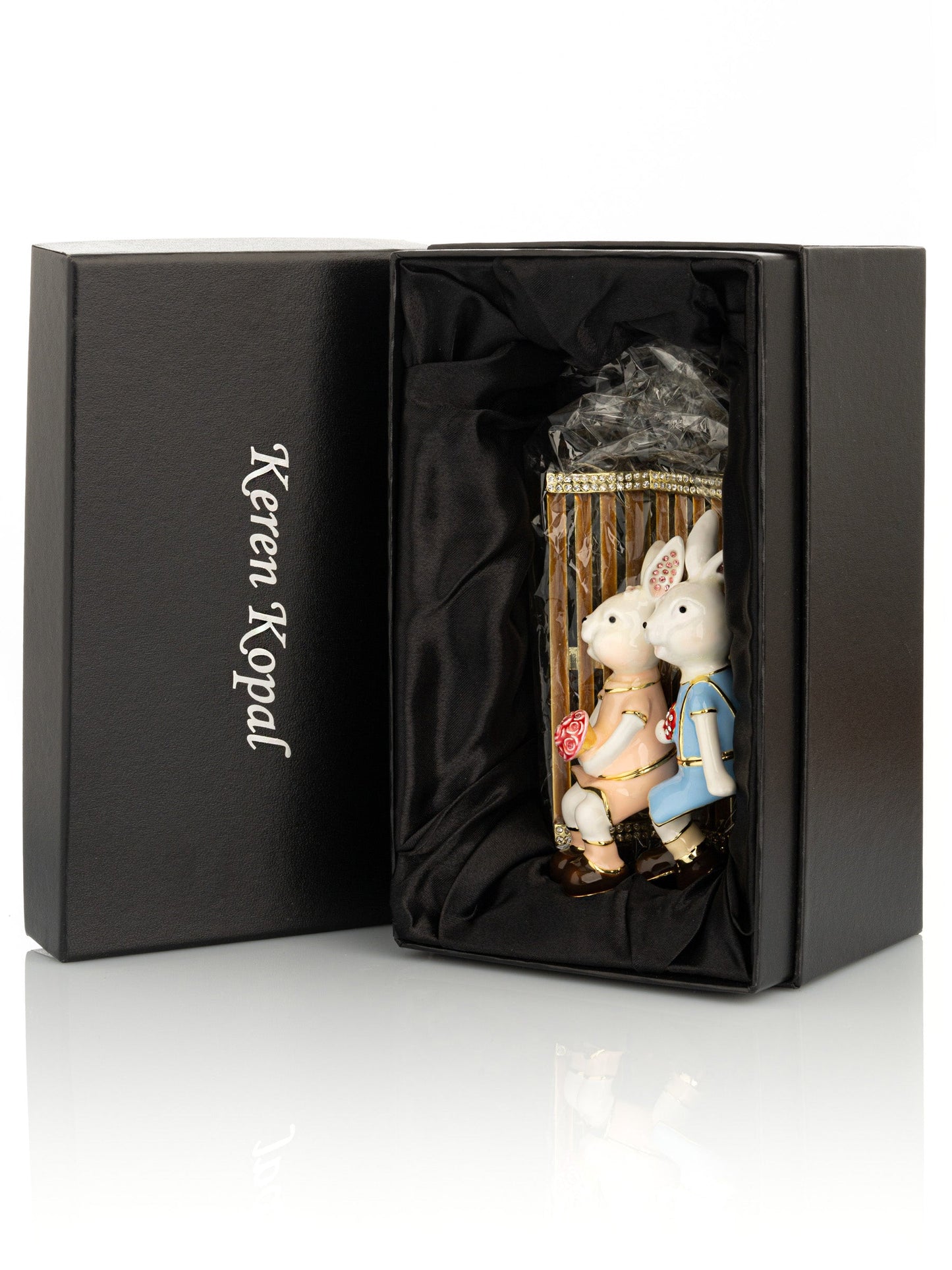 Keren Kopal 2 bunnies in love sitting on a bench, valentine flowers and chocolates