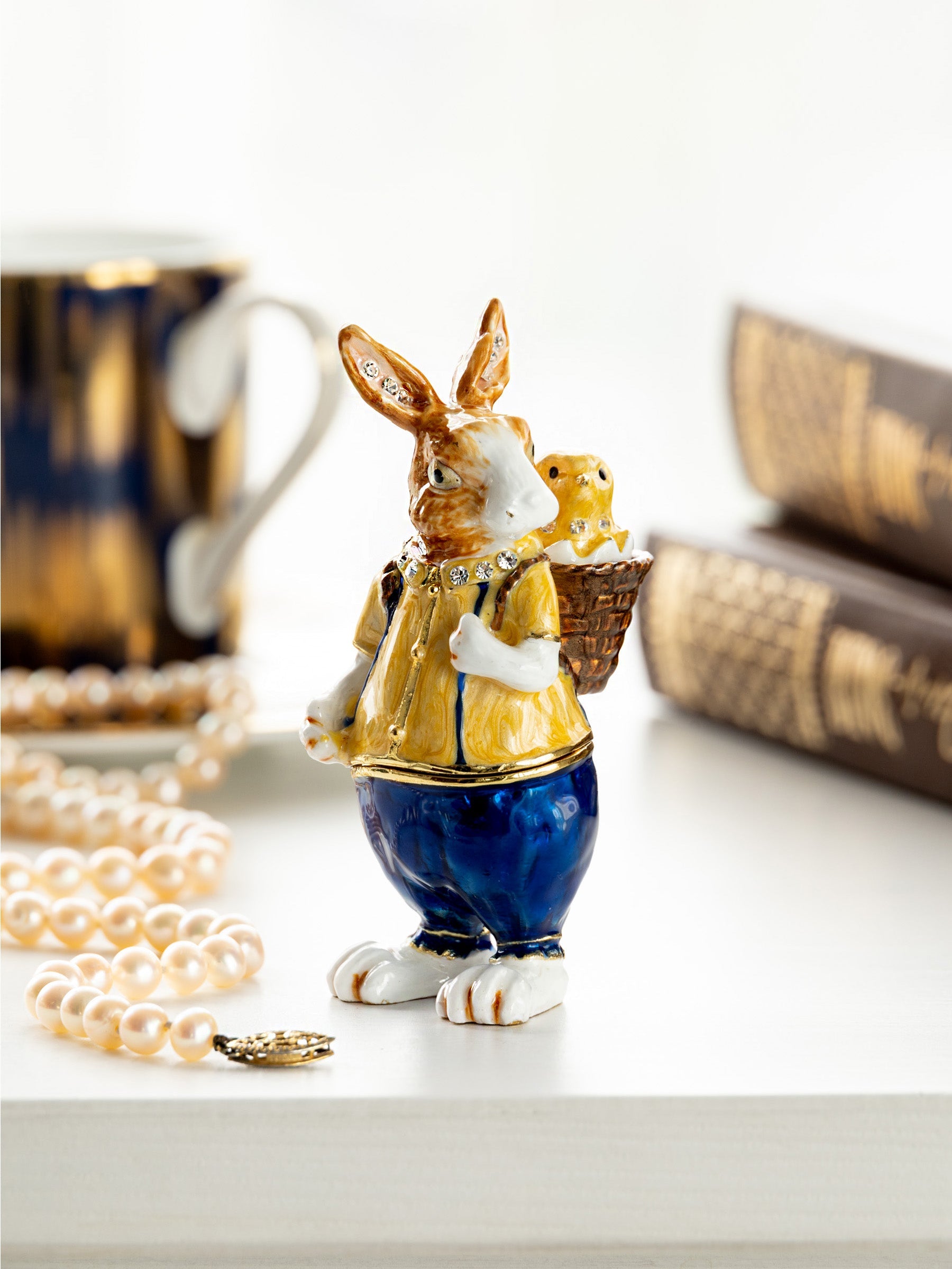 Keren Kopal Easter bunny carrying a baby chick on a basket