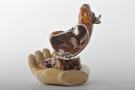 Keren Kopal Zodiac Ox Laying on Hand